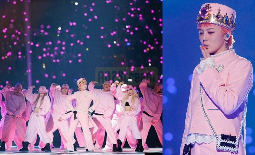 Bigbang mengenakan busana berwarna pink yang mencerminkan selera fashionnya yang khas dan kepribadian uniknya